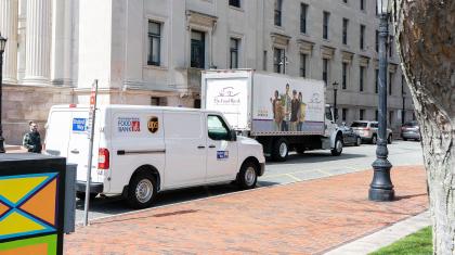 A United Way van and Food Bank of Western Mass truck parked next to eachother.