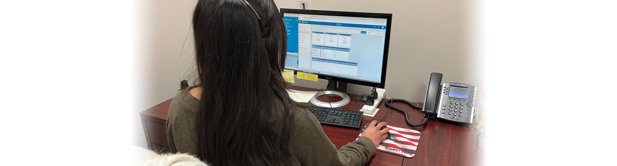 Volunteer answering calls for Call2Talk