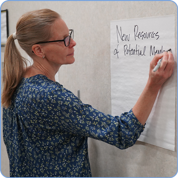 Woman writing on a board