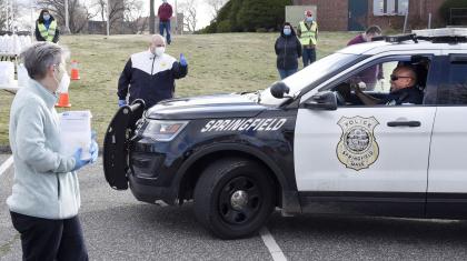 A police officer receiving a grab-and-go bag.